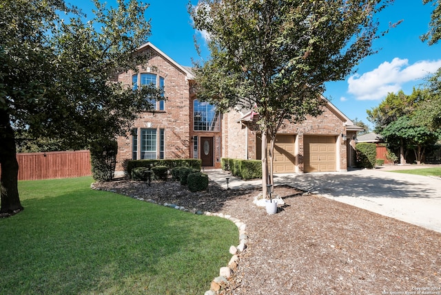 view of front property with a garage and a front lawn