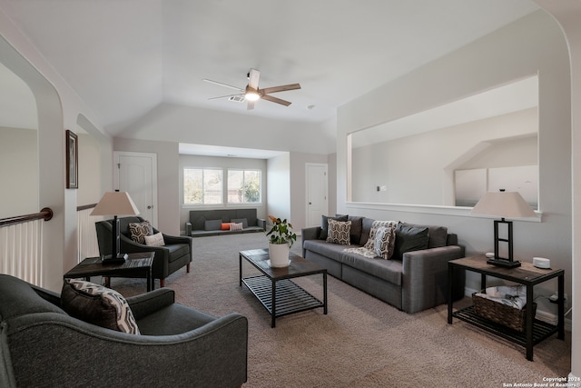 living room featuring ceiling fan, light colored carpet, and lofted ceiling