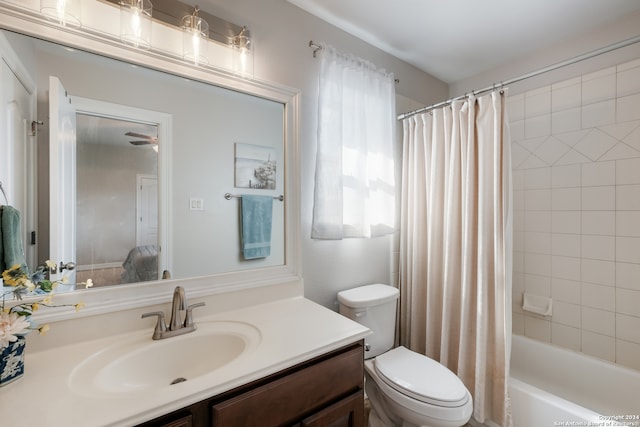 full bathroom with vanity, shower / bath combination with curtain, and toilet