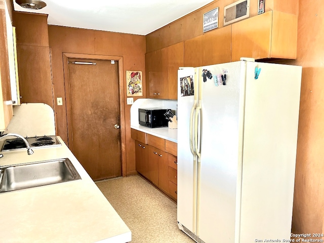 kitchen with white fridge and sink