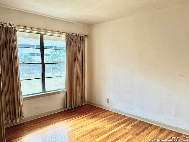 unfurnished room featuring light hardwood / wood-style floors