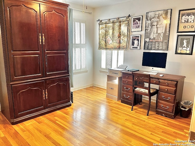 office space with light hardwood / wood-style flooring