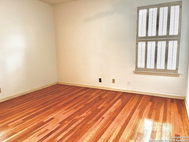 empty room with light hardwood / wood-style floors