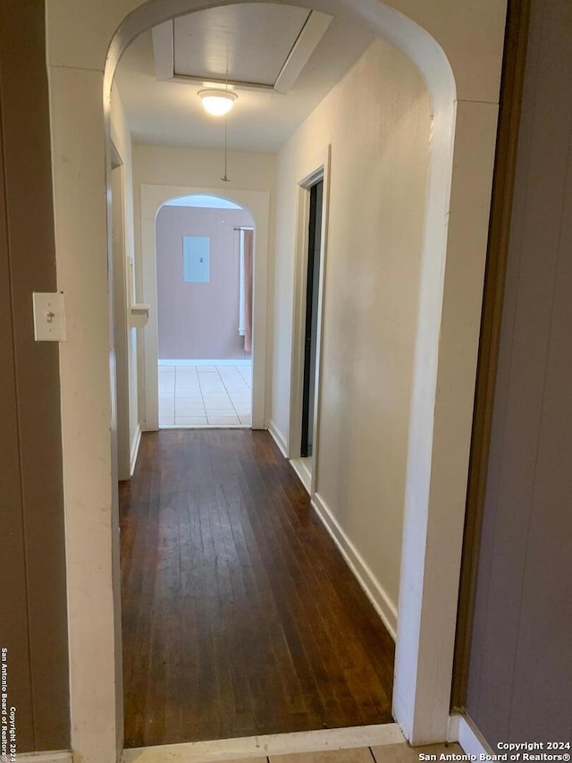 corridor featuring hardwood / wood-style floors