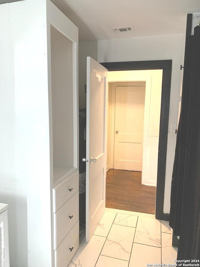 hallway with light wood-type flooring