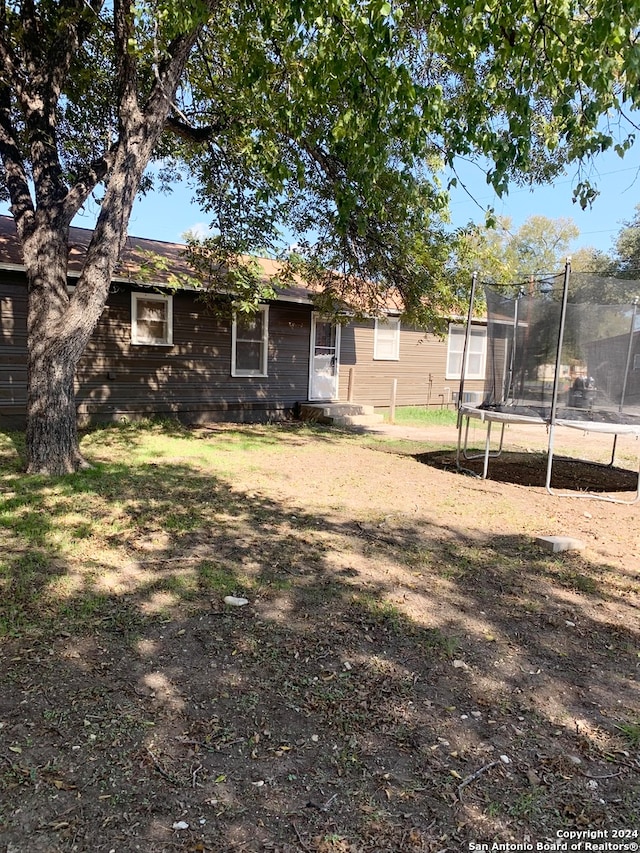 view of yard with a trampoline