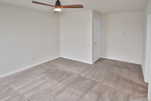 empty room featuring carpet flooring and ceiling fan