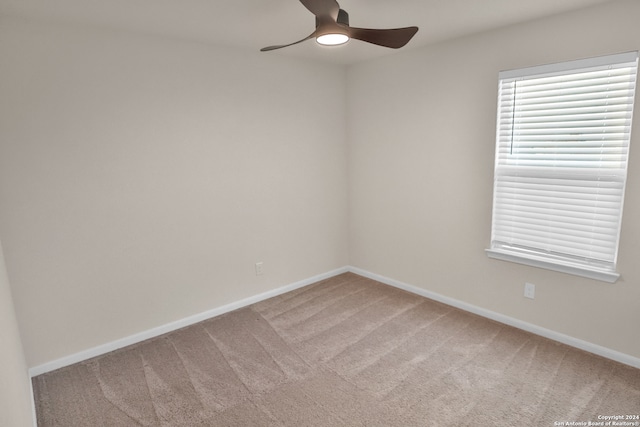 carpeted empty room with ceiling fan