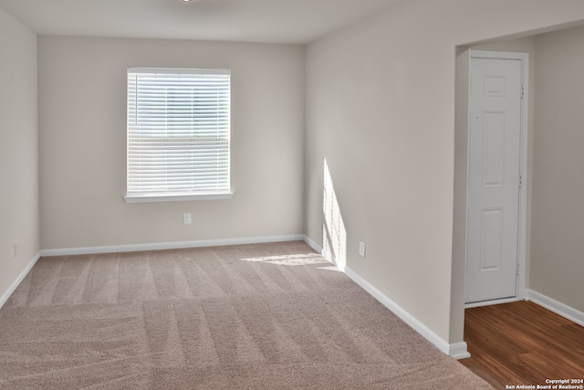 unfurnished room featuring hardwood / wood-style floors