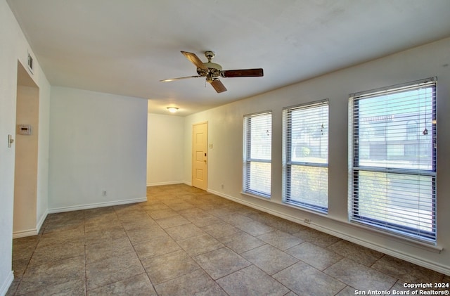 spare room with ceiling fan