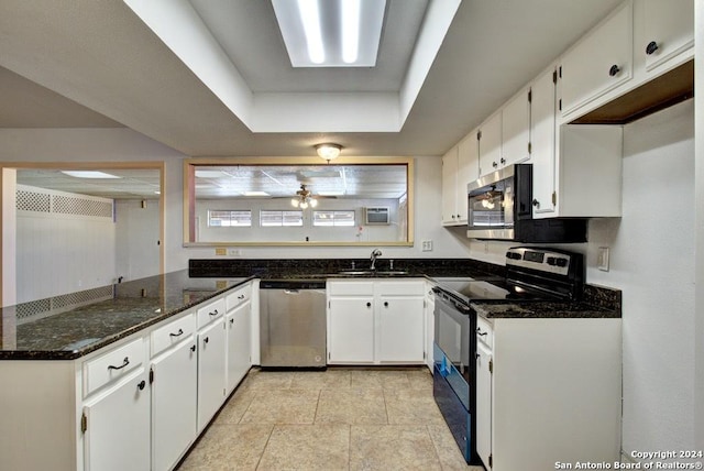6810 Crown Rdg, San Antonio, TX 78239 - kitchen with appliances with stainless steel finishes, dark stone counters, a sink, and white cabinets