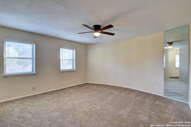 6810 Crown Rdg, San Antonio, TX 78239 - unfurnished room featuring ceiling fan, carpet flooring, and healthy amount of natural light