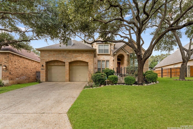 view of front of house with a front lawn and a garage