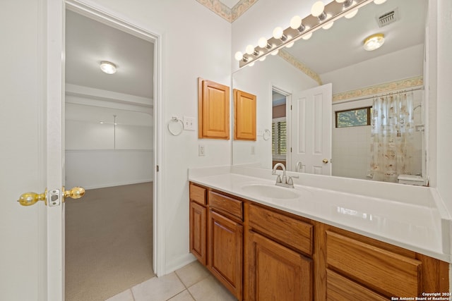 bathroom featuring vanity, tile patterned floors, and a shower with shower curtain