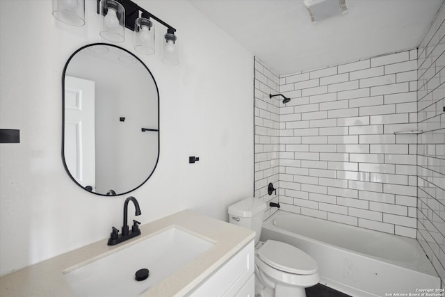 full bathroom featuring vanity, toilet, and tiled shower / bath