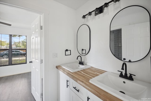 bathroom featuring vanity and wood-type flooring