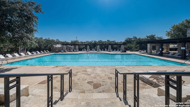 view of swimming pool with a patio area