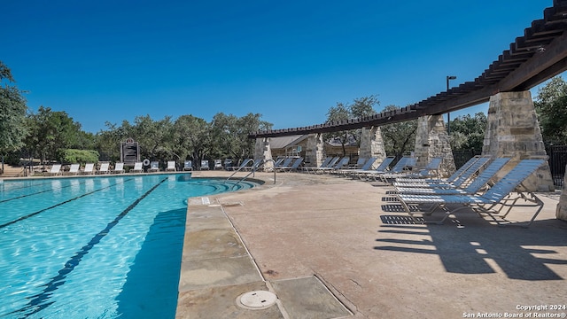 view of pool featuring a patio