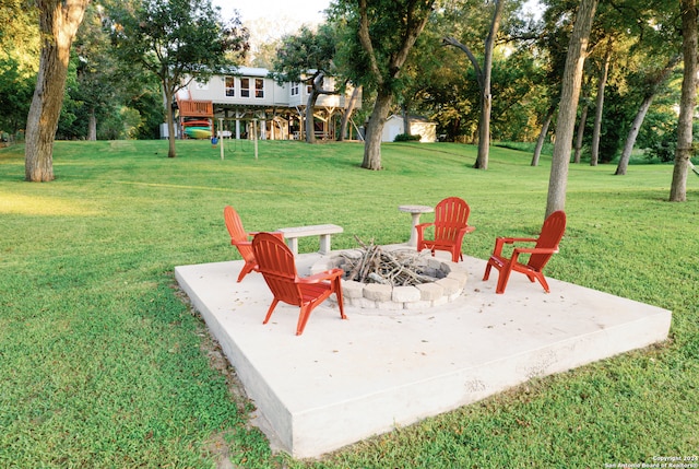 view of yard featuring an outdoor fire pit and a patio area