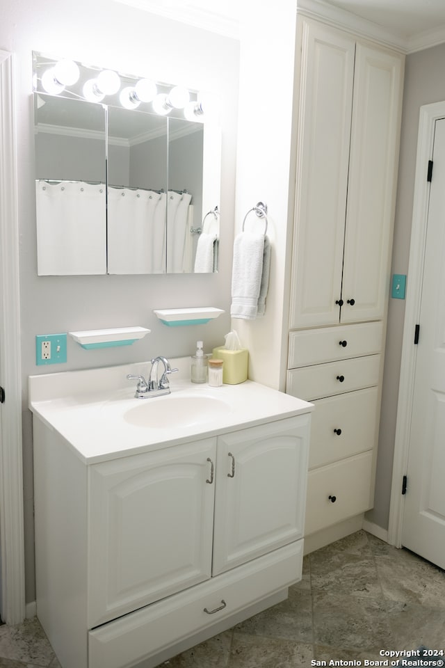 bathroom with a shower with shower curtain, vanity, and ornamental molding