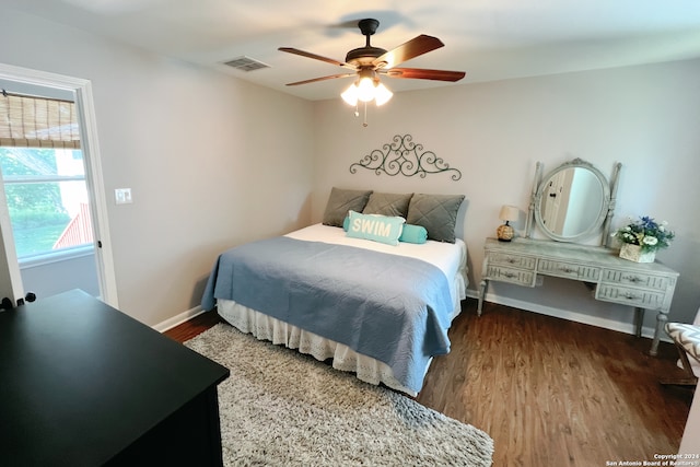 bedroom with wood-type flooring and ceiling fan