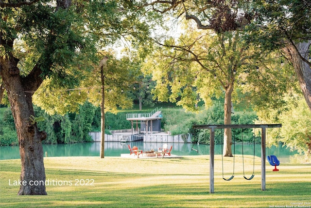 surrounding community featuring a yard and a water view