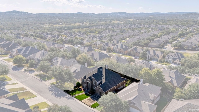 birds eye view of property with a mountain view