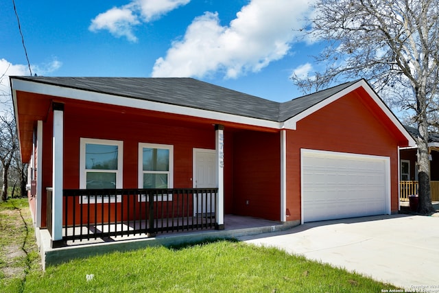 view of front of house featuring covered porch and a garage