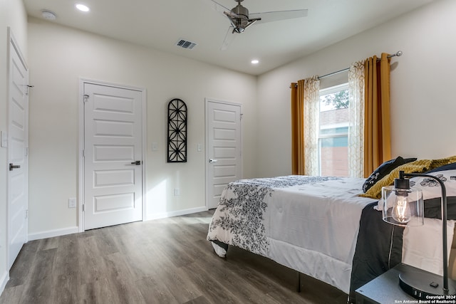 bedroom featuring ceiling fan and dark hardwood / wood-style flooring