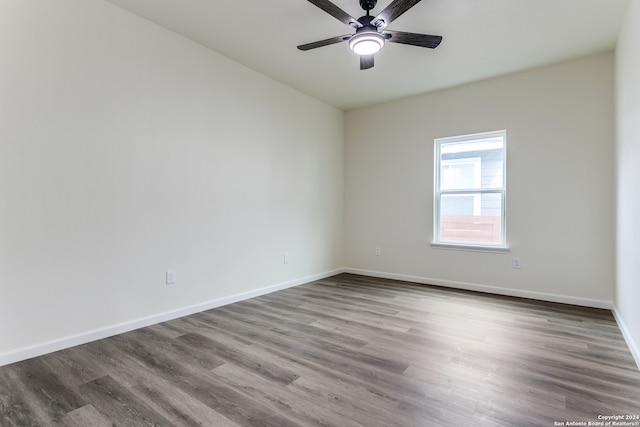 spare room featuring hardwood / wood-style flooring and ceiling fan