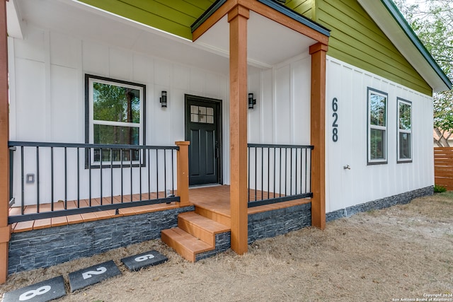 doorway to property featuring a porch