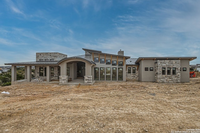 back of house with a patio area