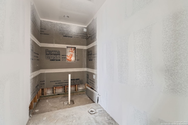 bathroom with concrete flooring