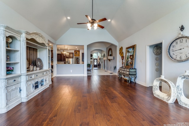 unfurnished living room with ceiling fan with notable chandelier, built in shelves, high vaulted ceiling, and dark hardwood / wood-style floors