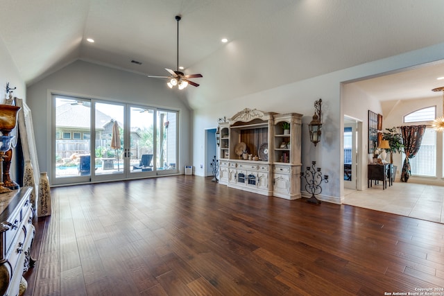 unfurnished living room featuring hardwood / wood-style flooring, ceiling fan, and lofted ceiling