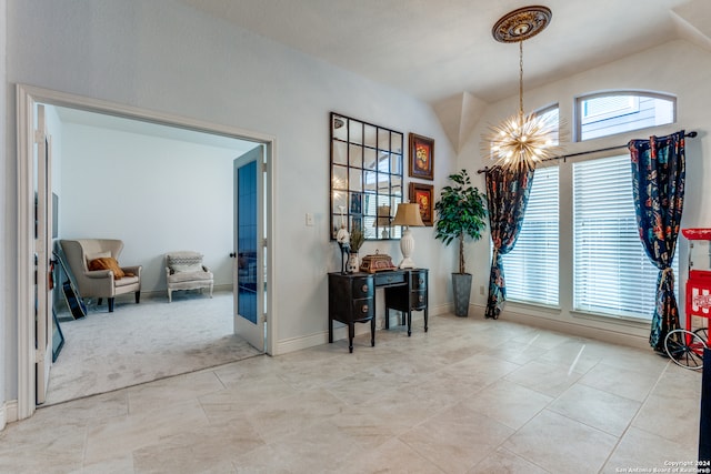 interior space featuring light carpet, vaulted ceiling, and an inviting chandelier