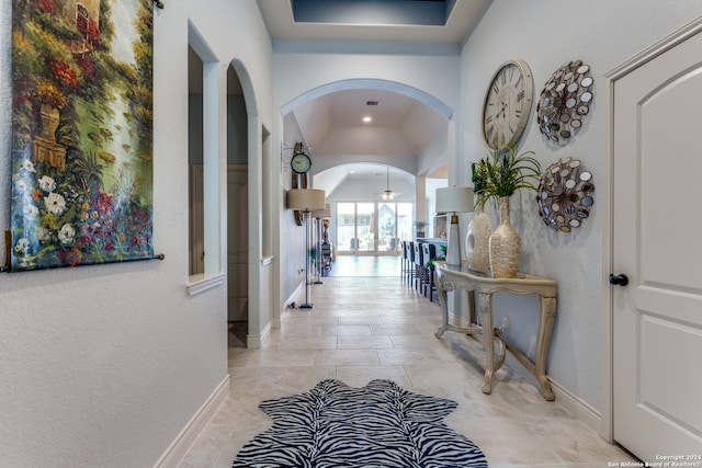 corridor with vaulted ceiling