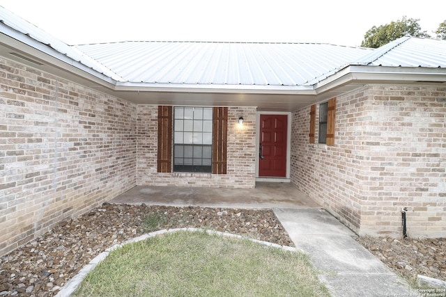 7227 Trace Buckle, San Antonio, TX 78240 - view of exterior entry with metal roof and brick siding