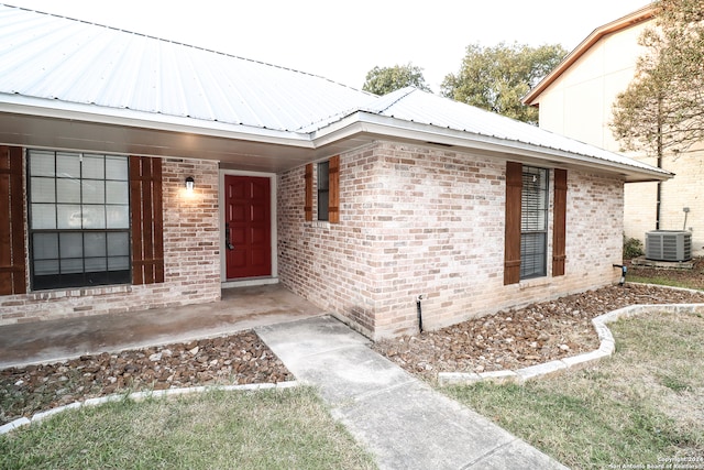 doorway to property with central AC