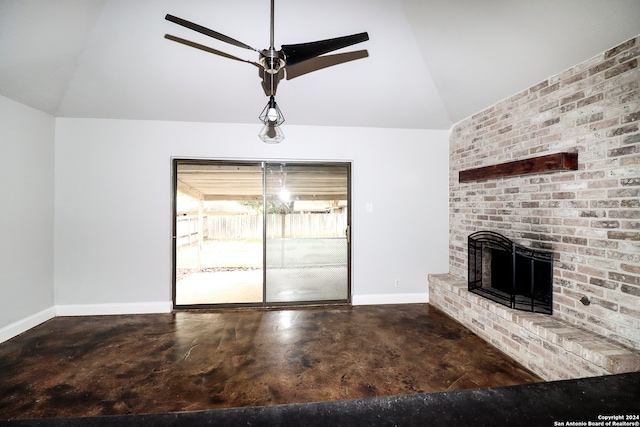 unfurnished living room with a brick fireplace, vaulted ceiling, and ceiling fan