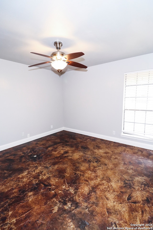 unfurnished room featuring ceiling fan