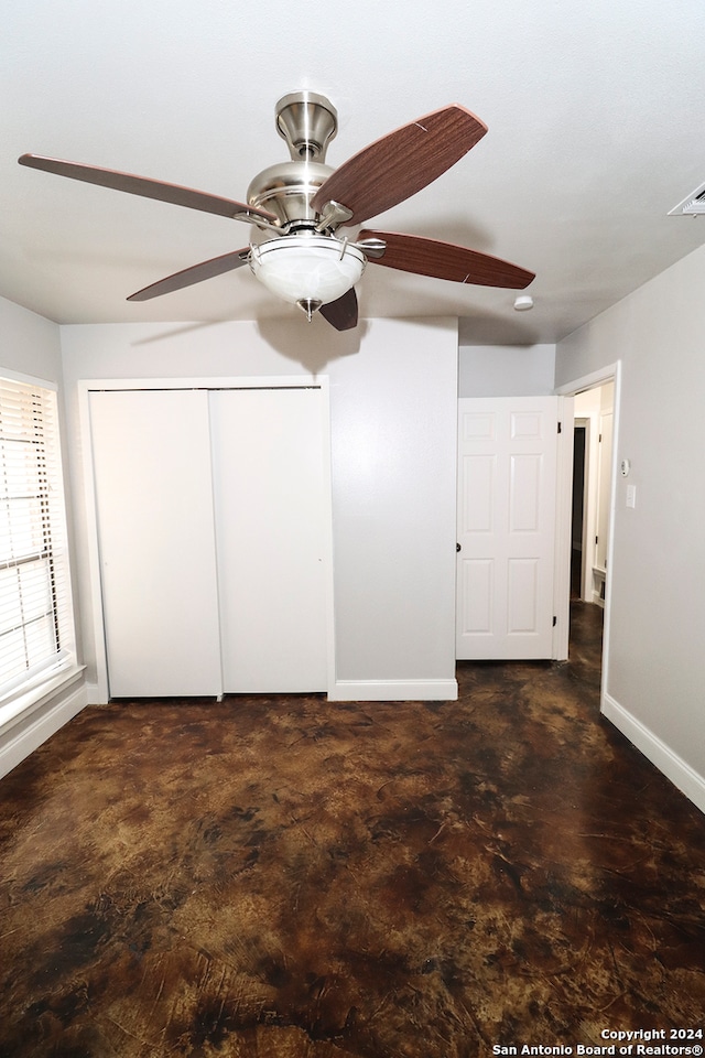 unfurnished bedroom featuring a closet and ceiling fan