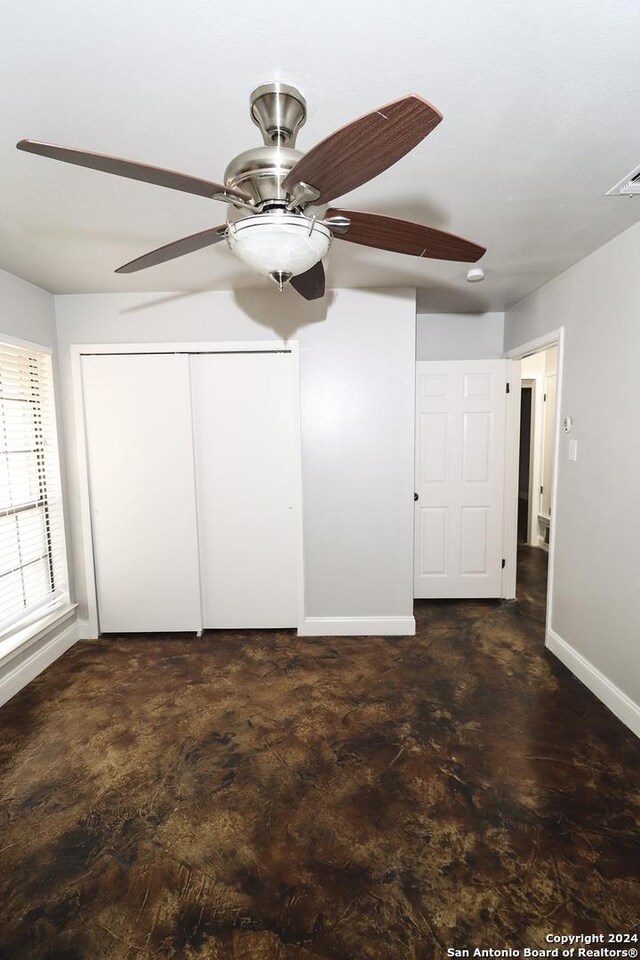 7227 Trace Buckle, San Antonio, TX 78240 - unfurnished bedroom with baseboards, a closet, and a ceiling fan