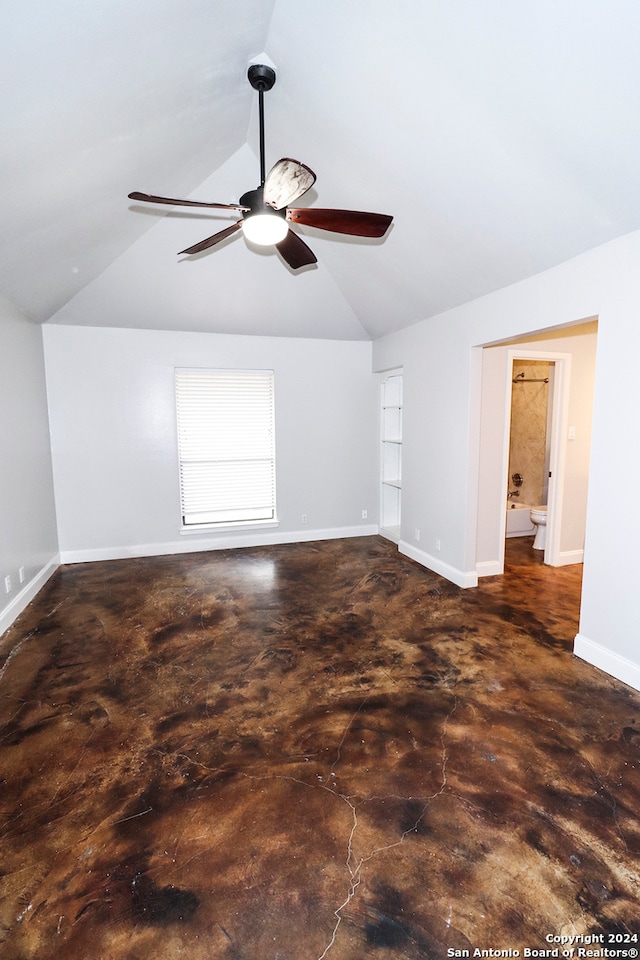 spare room with vaulted ceiling and ceiling fan