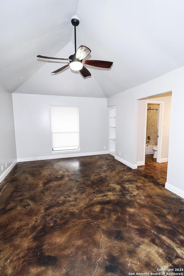 7227 Trace Buckle, San Antonio, TX 78240 - unfurnished room with ceiling fan, lofted ceiling, baseboards, and concrete flooring