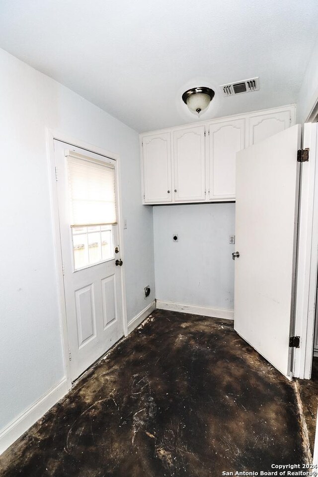 7227 Trace Buckle, San Antonio, TX 78240 - clothes washing area with cabinet space, hookup for an electric dryer, and baseboards