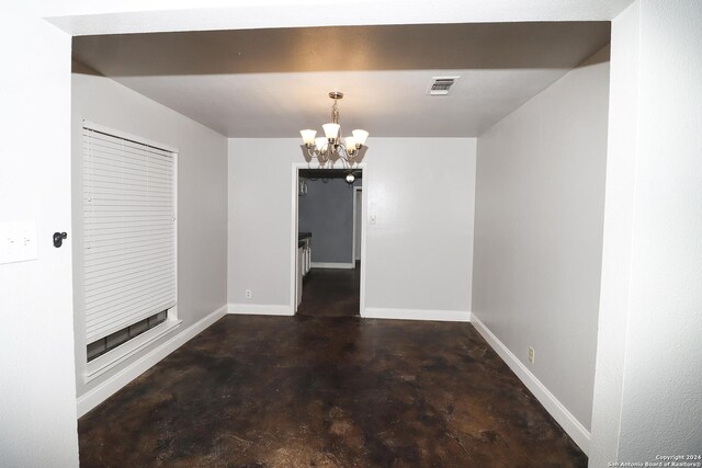7227 Trace Buckle, San Antonio, TX 78240 - unfurnished dining area featuring finished concrete flooring, a chandelier, and baseboards