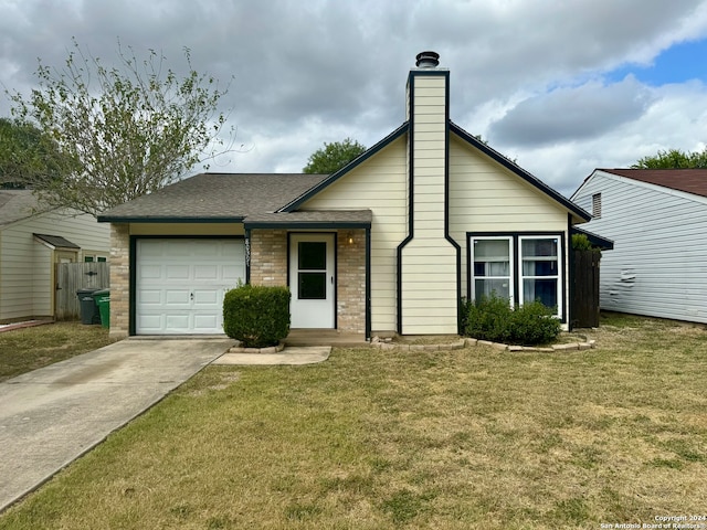 single story home featuring a front yard and a garage