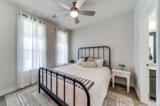 bedroom featuring ensuite bath, carpet floors, and ceiling fan