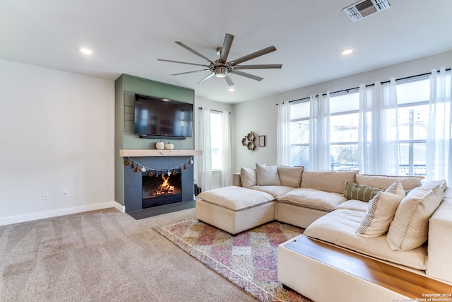 living room featuring ceiling fan and light carpet